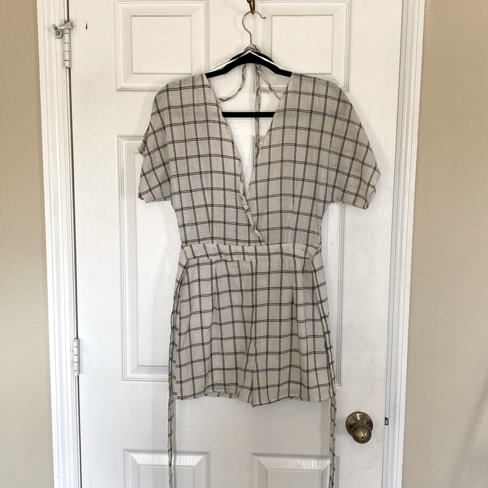 Open back romper, size small. Never worn